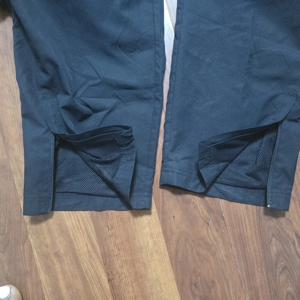Under Armour Mens 3XL Black Loose Fit Mesh Lined Woven Track Pants Zipper Ankle